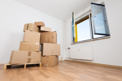 Professional movers handling household items in Morden