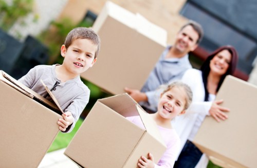 Packed boxes and small furniture ready for student removals in Morden