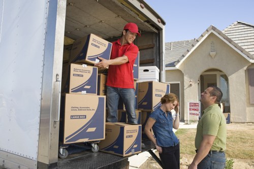 Professional movers handling stairs and shared access in a flat building
