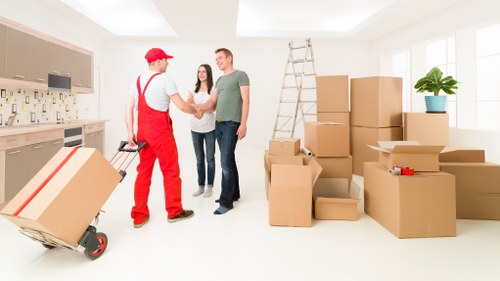 Supervisor reviewing health and safety procedures for a removal service