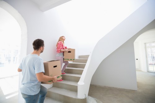 Furniture and boxes loaded for transport by a van service in Morden